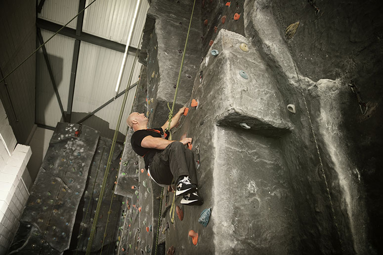 Man in wheelcyhair on climbing wall